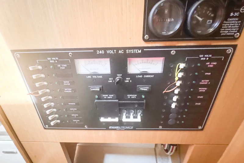 Slide: The Image of Electrical panel of a 2010 Fountaine Pajot Lipari 41 catamaran, featuring 240-volt AC system controls. - 31