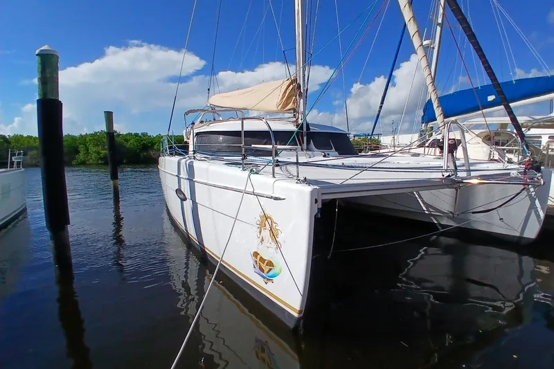 The Image of 2010 Fountaine Pajot Lipari 41 catamaran docked in sunny marina. - 0