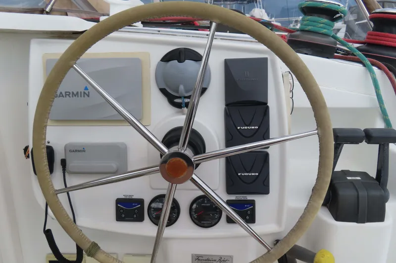Slide: The Image of Steering wheel and navigation instruments on a 2010 Fountaine Pajot Lipari 41 catamaran. - 13
