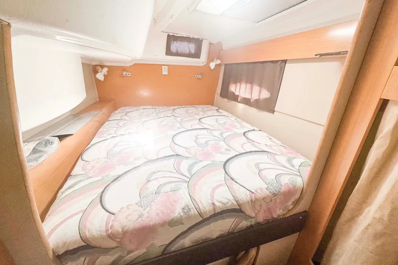 Slide: The Image of Cozy cabin interior of 2010 Fountaine Pajot Lipari 41 catamaran with floral bedding. - 27