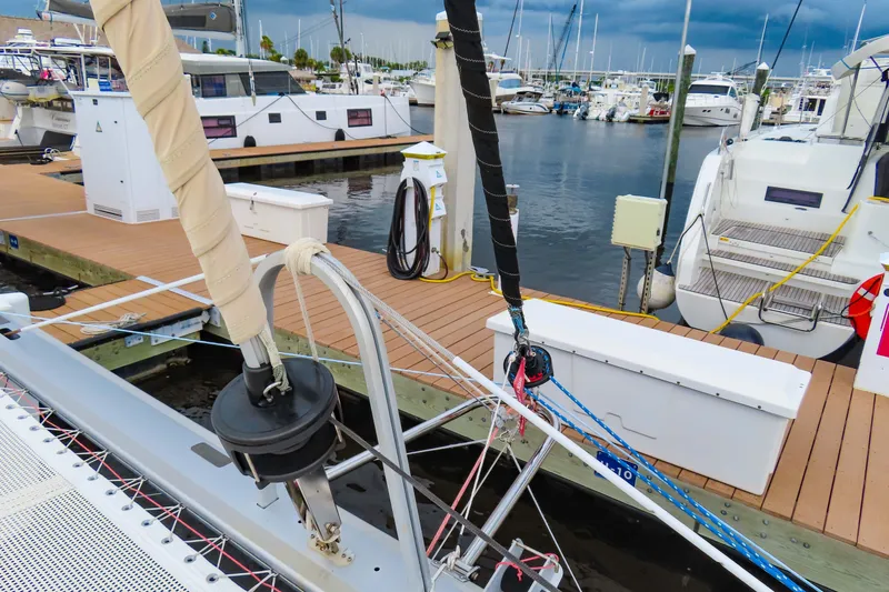 Slide: The Image of Docked 2010 Fountaine Pajot Lipari 41 catamaran at marina, surrounded by boats. - 5