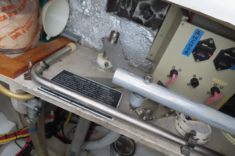 Slide: The Image of Engine compartment of 2010 Fountaine Pajot Lipari 41 with control panel and discharge warning. - 37