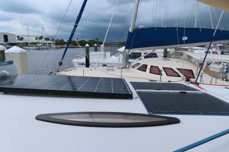 Slide: The Image of 2010 Fountaine Pajot Lipari 41 catamaran with solar panels docked at marina. - 15