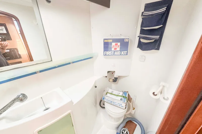 Slide: The Image of Bathroom of 2010 Fountaine Pajot Lipari 41 with first aid kit and storage. - 29