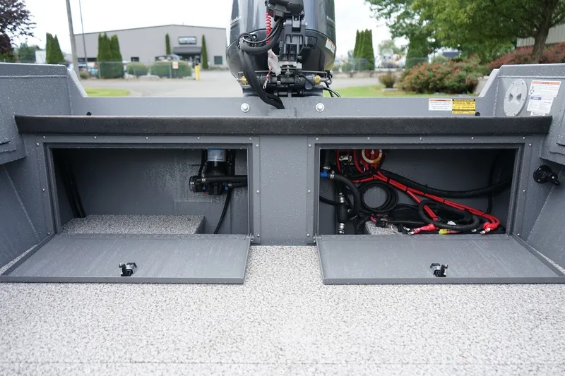 Slide: The Image of 2026 Alumaweld Super Vee 20 boat compartments with wiring and equipment visible. - 7