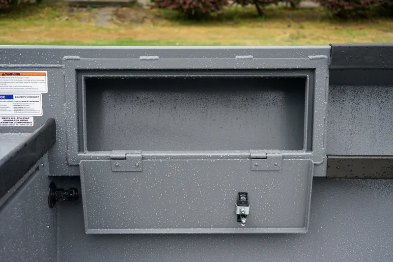Slide: The Image of 2026 Alumaweld Super Vee 20 storage compartment with raindrops on gray surface. - 8
