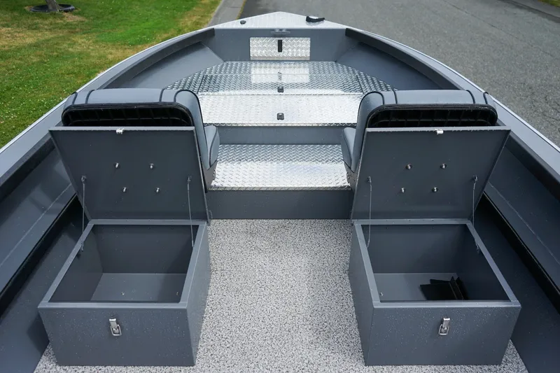 Slide: The Image of 2026 Alumaweld Super Vee 20 boat interior with storage compartments and diamond plate flooring. - 13