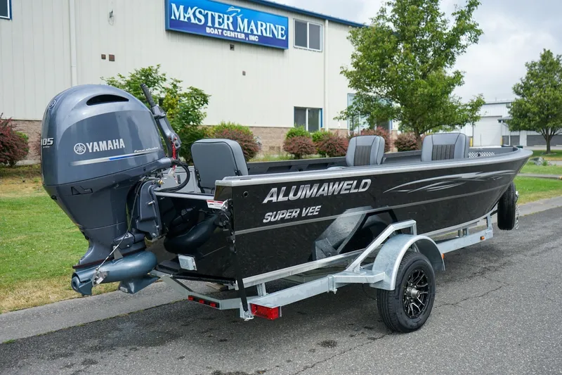 Slide: The Image of 2026 Alumaweld Super Vee 20 boat with Yamaha motor on trailer, parked outside Master Marine. - 3