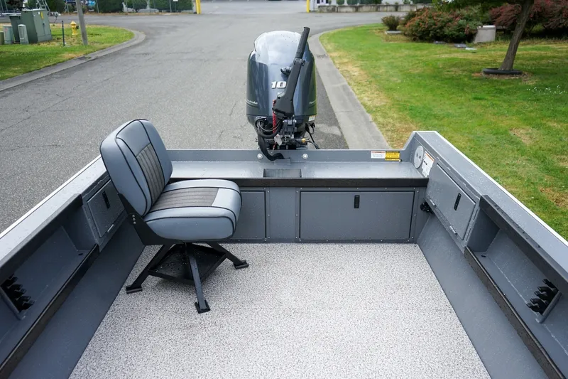 Slide: The Image of 2026 Alumaweld Super Vee 20 boat interior with swivel seat and outboard motor. - 6
