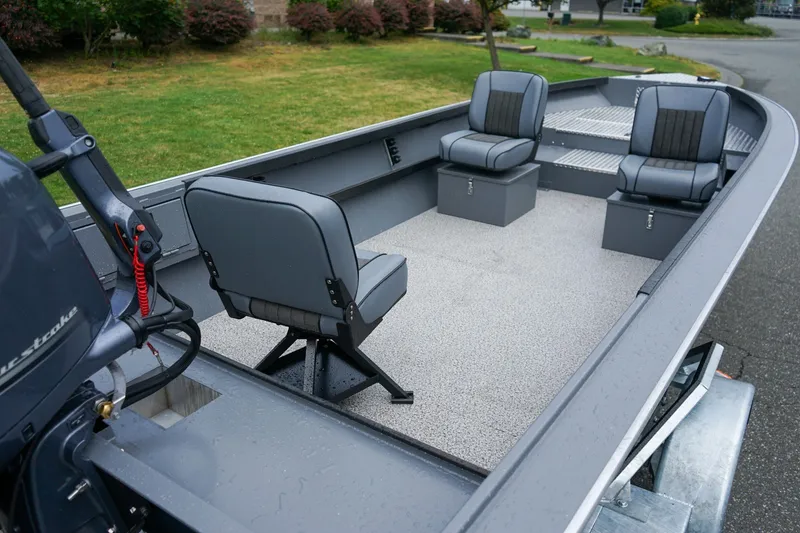 Slide: The Image of 2026 Alumaweld Super Vee 20 boat interior with three gray seats and motor. - 5