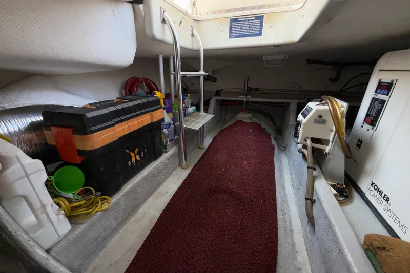 Slide: The Image of 2006 Mainship 34 Trawler engine room with tools and Kohler power system. - 20