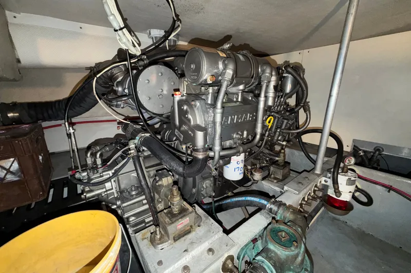 Slide: The Image of Engine room of 2006 Mainship 34 Trawler, showcasing detailed mechanical components. - 28