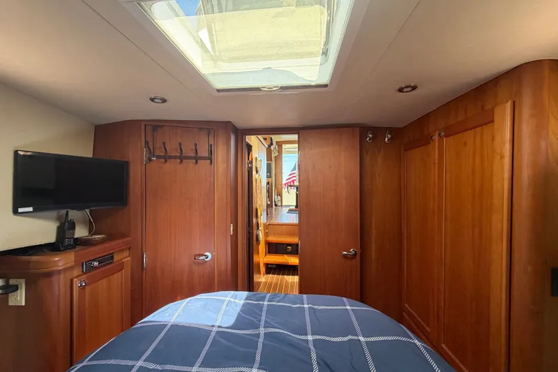 Slide: The Image of Interior of 2006 Mainship 34 Trawler with wood paneling and skylight. - 92