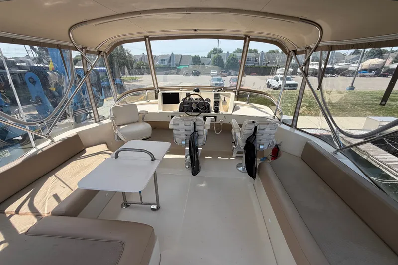 Slide: The Image of Interior view of 2006 Mainship 34 Trawler with seating and helm station. - 46