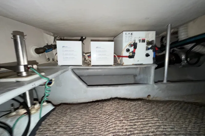 Slide: The Image of Engine room of 2006 Mainship 34 Trawler with electrical components and wiring. - 24