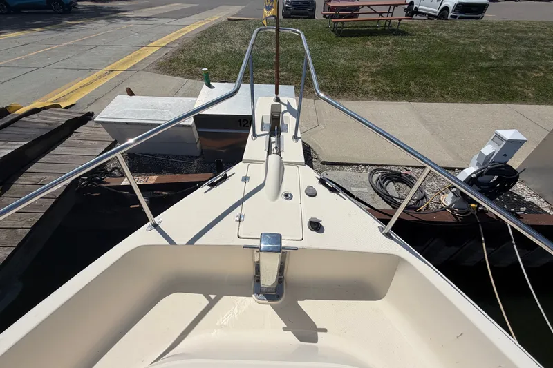 Slide: The Image of Bow view of 2006 Mainship 34 Trawler docked at marina. - 7