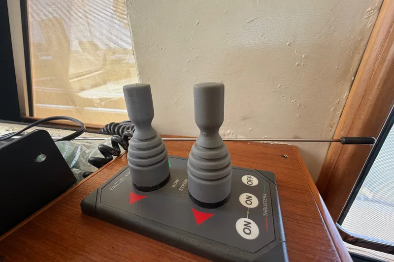 Slide: The Image of Control panel of a 2006 Mainship 34 Trawler with joystick thrusters. - 79