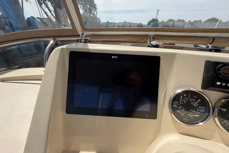 Slide: The Image of Helm of 2006 Mainship 34 Trawler with navigation screen and gauges. - 53