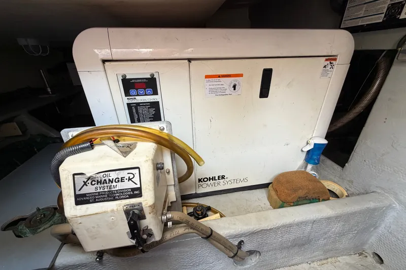 Slide: The Image of Engine room of 2006 Mainship 34 Trawler with Kohler power system and oil exchange unit. - 21