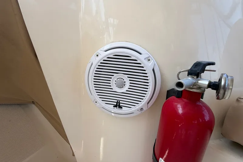 Slide: The Image of Speaker and fire extinguisher on 2006 Mainship 34 Trawler boat interior. - 63