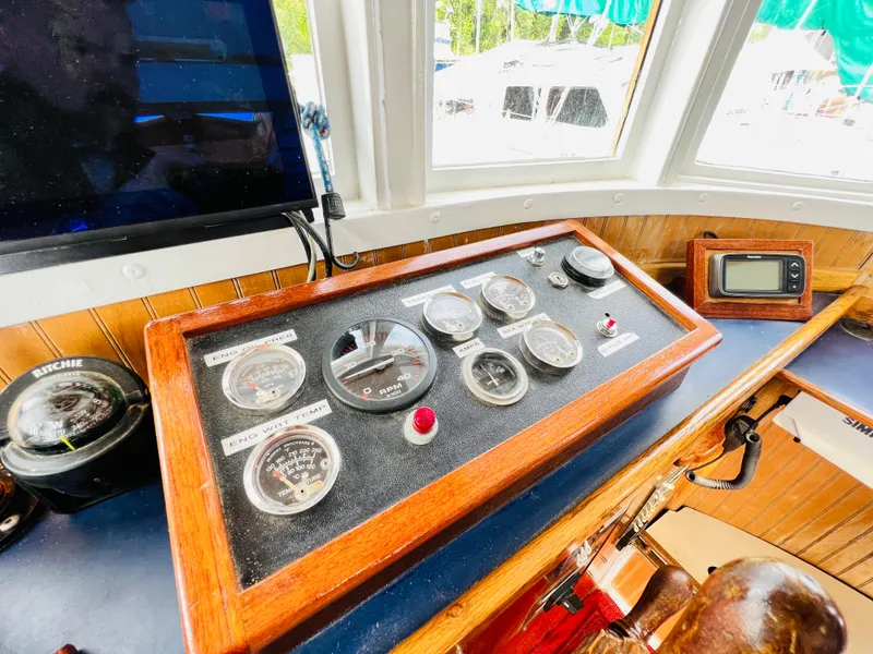 Slide: The Image of Control panel of a 1955 Colin Archer 42 boat with gauges and navigation instruments. - 15
