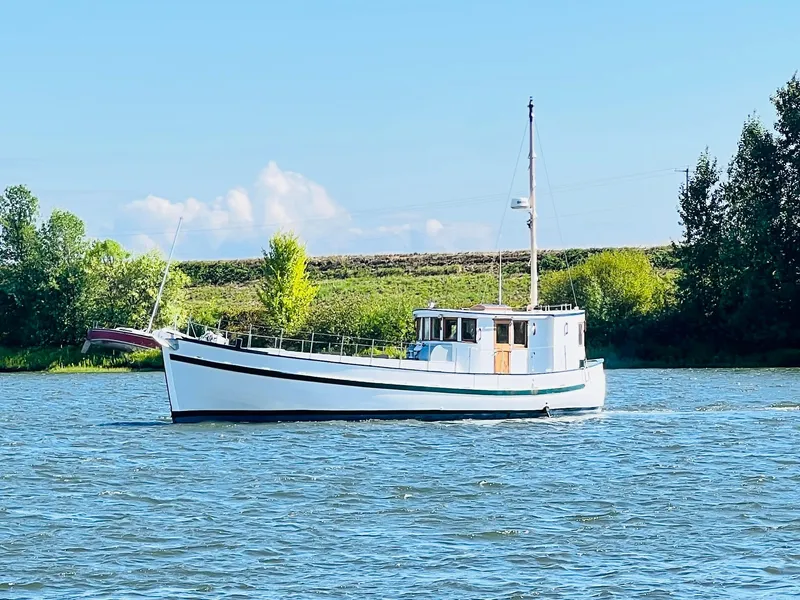 The Image of 1955 Colin Archer 42 boat sailing on a calm river. - 0