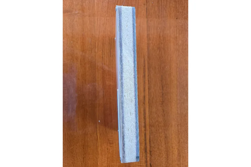Slide: The Image of Close-up of a book spine on a wooden surface, Raymond Hunt Sport Fisher 1984. - 16