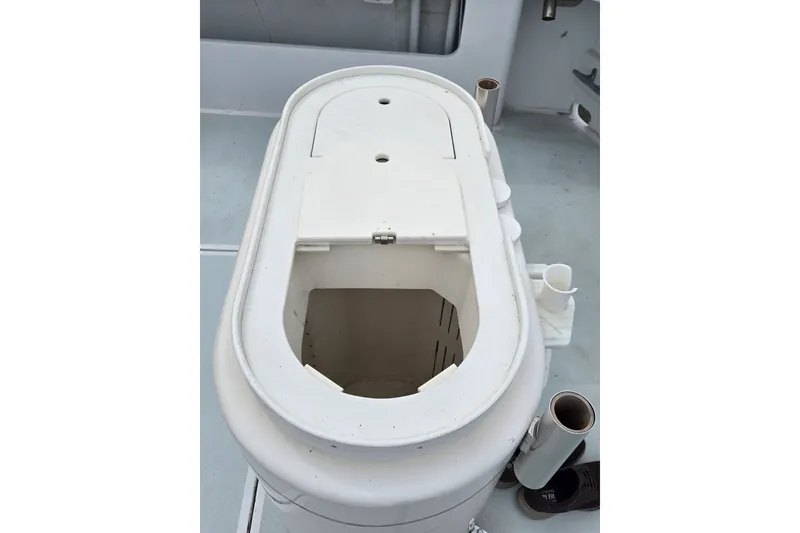 Slide: The Image of 1984 Raymond Hunt Sport Fisher boat deck with open storage compartment. - 21
