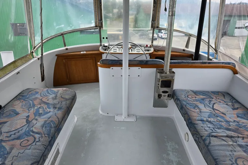 Slide: The Image of 1984 Raymond Hunt Sport Fisher interior with patterned seating and control panel. - 27