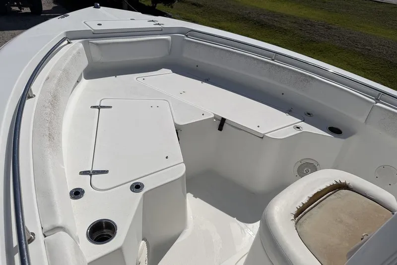 Slide: The Image of 2013 Sea Hunt Ultra 234 boat interior with seating and storage compartments. - 5