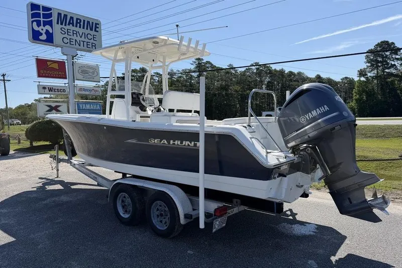 Slide: The Image of 2013 Sea Hunt Ultra 234 boat on trailer at marine service center. - 3