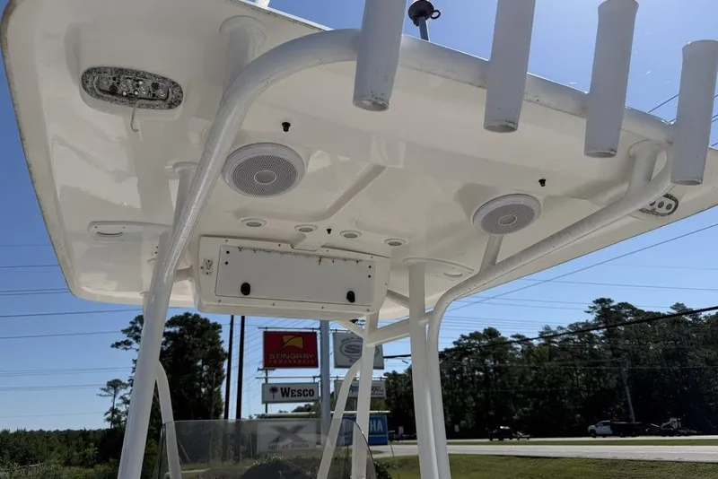 Slide: The Image of T-top of 2013 Sea Hunt Ultra 234 boat with speakers and rod holders. - 14
