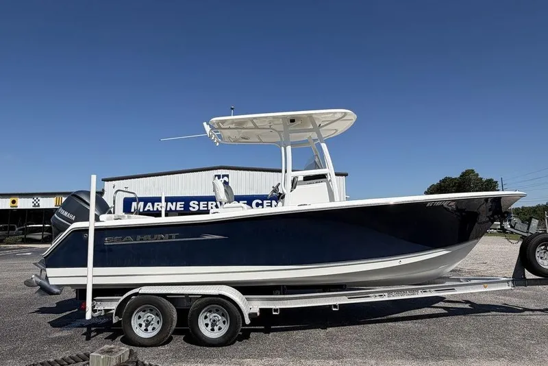 Slide: The Image of 2013 Sea Hunt Ultra 234 boat on trailer at marine service center. - 4