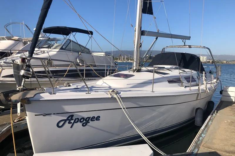 The Image of 2008 Hunter 38 sailboat named "Apogee" docked at a marina. - 0
