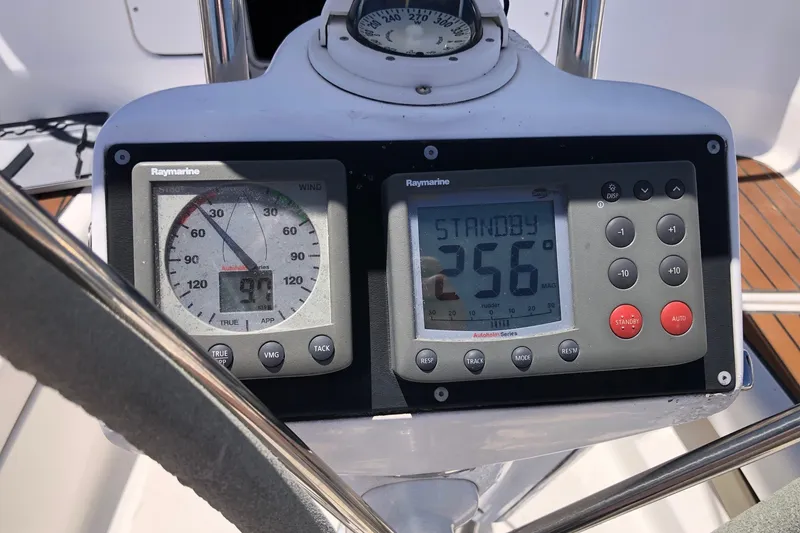 Slide: The Image of Raymarine navigation instruments on a 2008 Hunter 38 sailboat dashboard. - 27