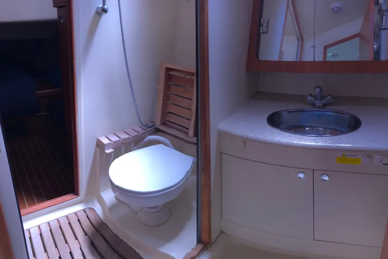 Slide: The Image of Bathroom interior of a 2008 Hunter 38 yacht with toilet and sink. - 13