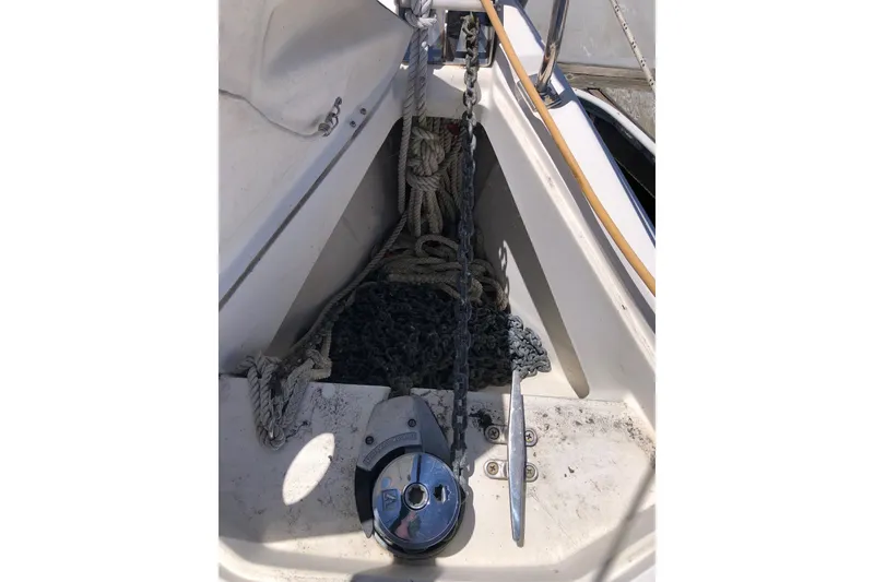 Slide: The Image of 2008 Hunter 38 sailboat anchor chain and windlass in bow compartment. - 18