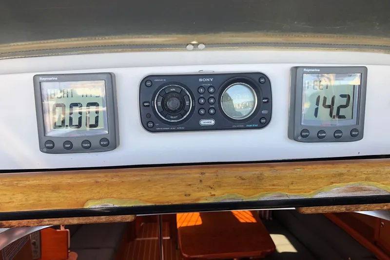 Slide: The Image of Control panel of a 2008 Hunter 38 sailboat with navigation instruments. - 28