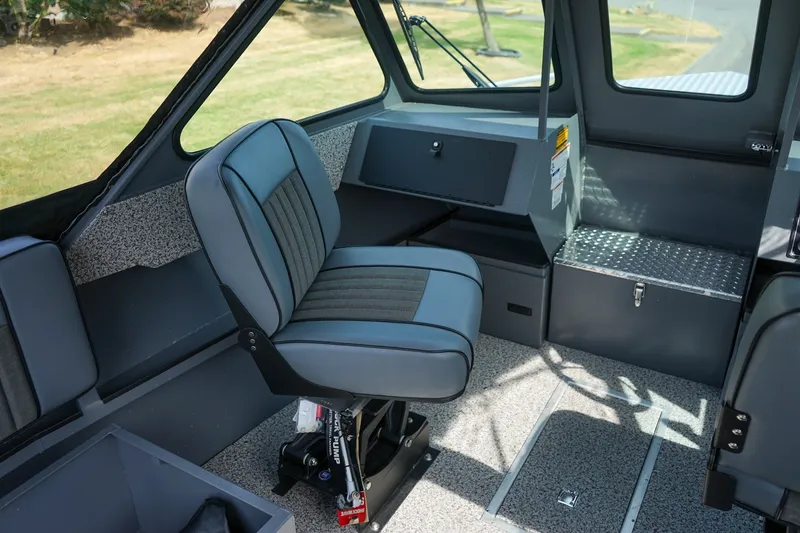 Slide: The Image of 2026 Alumaweld Intruder Outboard 22 interior with modern seating and dashboard design. - 14