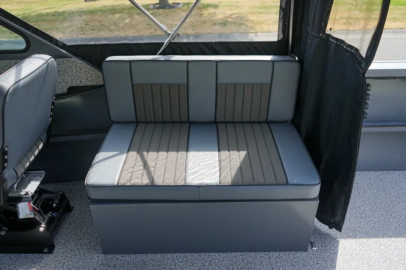 Slide: The Image of 2026 Alumaweld Intruder Outboard 22 interior seating, featuring gray and black upholstery. - 8