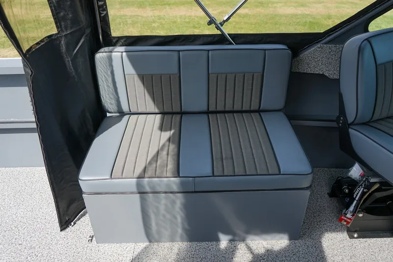 Slide: The Image of 2026 Alumaweld Intruder Outboard 22 interior seating with gray and black upholstery. - 10