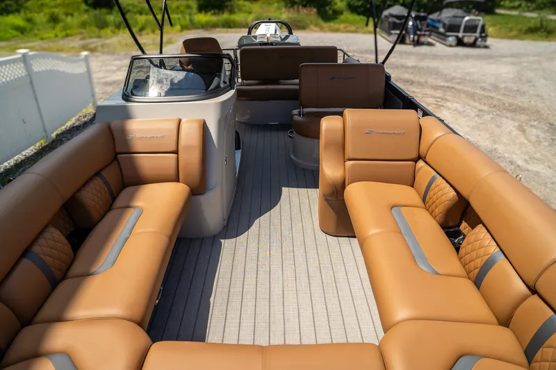 Slide: The Image of Starcraft RX 25 DL BAR 2025: Luxurious pontoon boat seating in brown with modern design. - 9