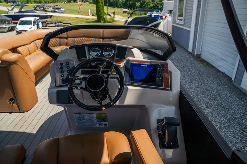 Slide: The Image of Starcraft RX 25 DL BAR 2025: Luxurious cockpit with modern steering wheel and navigation system. - 12
