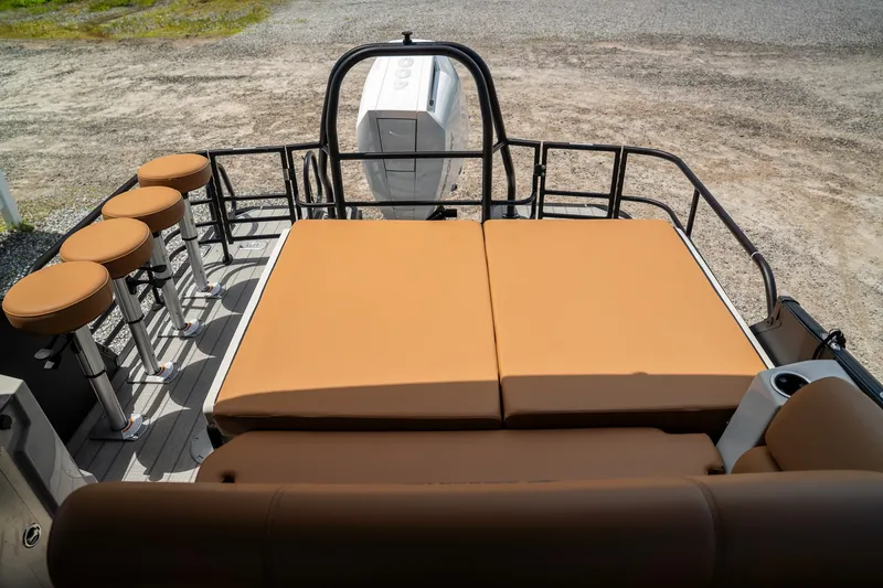 Slide: The Image of Starcraft RX 25 DL BAR 2025: Spacious deck with comfortable cushions and bar stools, perfect for relaxing. - 15