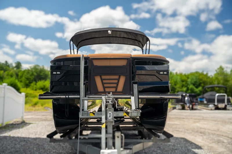 Slide: The Image of A 2025 Starcraft RX 25 DL BAR on a trailer, ready for transport. - 3
