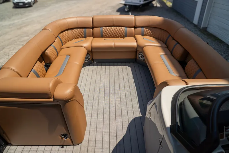 Slide: The Image of Luxurious brown leather seating in a boat with modern design and gray flooring. - 8