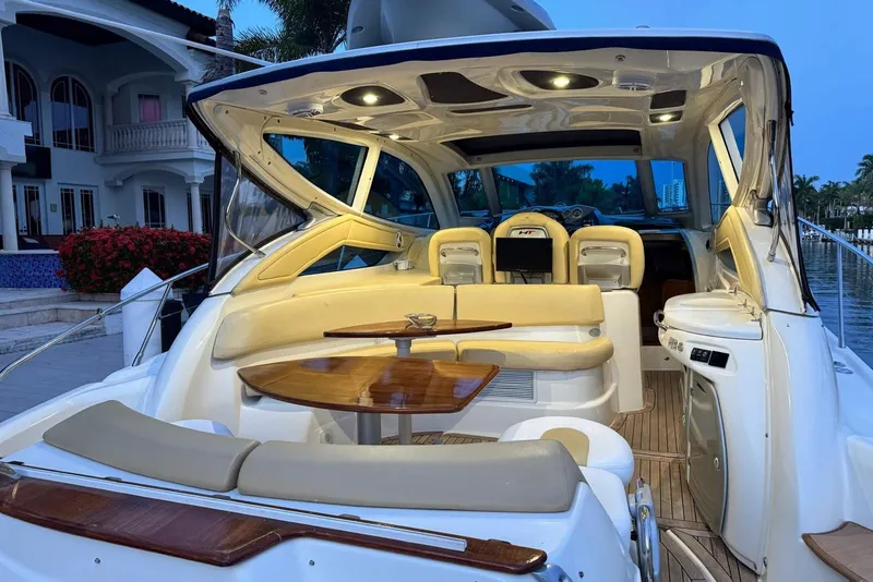 Slide: The Image of Luxurious 2009 Cranchi Mediterranee 43 yacht interior with elegant seating and wooden table. - 22