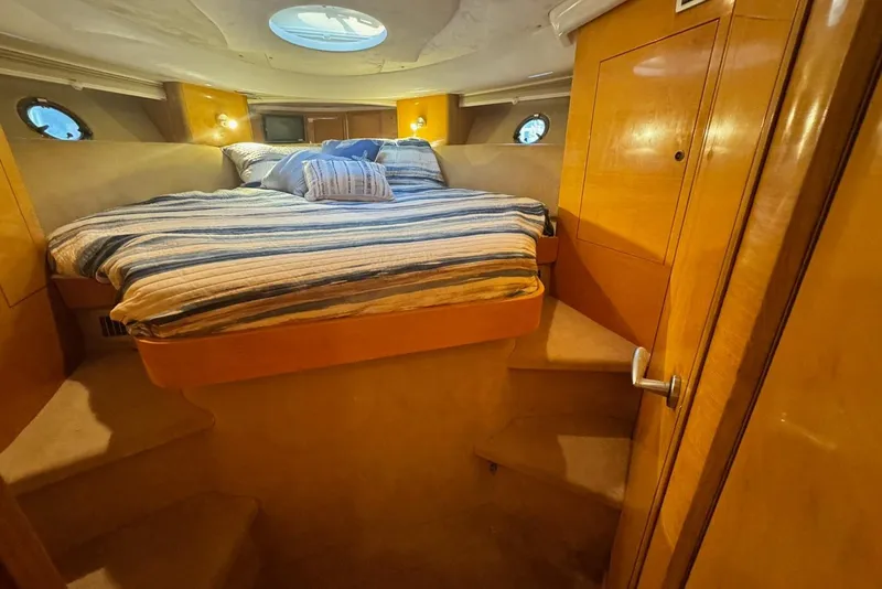 Slide: The Image of Luxurious cabin interior of 2009 Cranchi Mediterranee 43 yacht with cozy bed and wooden finish. - 21