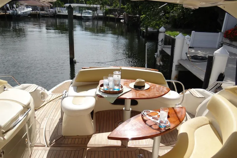 Slide: The Image of Luxurious 2009 Cranchi Mediterranee 43 yacht interior with elegant seating and wooden tables. - 9