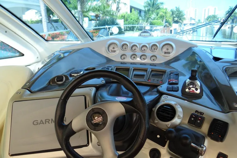 Slide: The Image of Cockpit of 2009 Cranchi Mediterranee 43 yacht with steering wheel and control panel. - 5